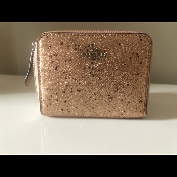 Coach Handbags - Coach pink holiday wallet.